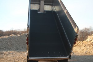 outdoor photo of a dump truck with black liner